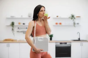 gut health and weight loss results woman with scale